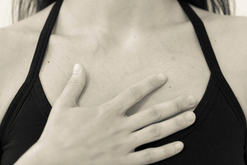 BW horizontal detail of chest and shoulders of yogini wearing black one jpeg
